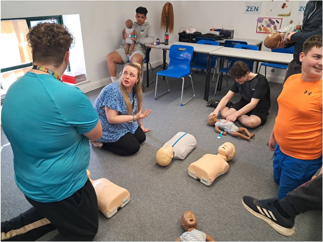 teacher and student talking about the CPR workshop