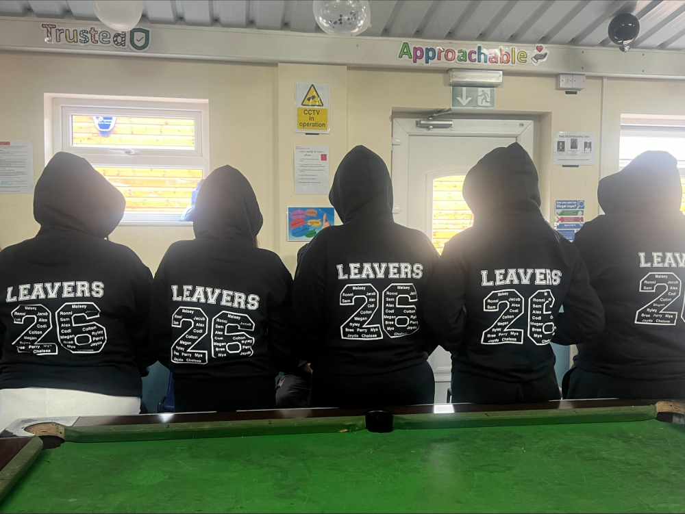 5 students with '26 leavers hoodies on