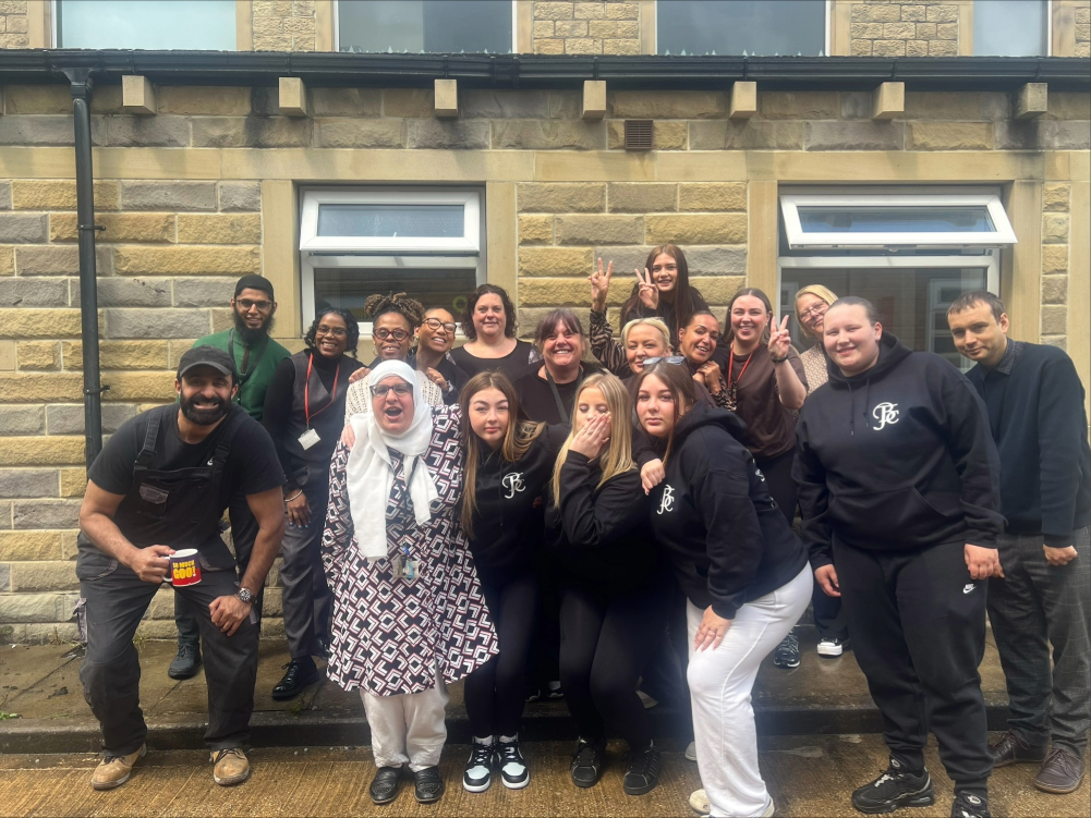 whole team at wellington house with students group picture