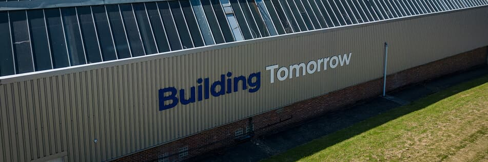 image of Accu building on the side with writing "Building tomorrow"